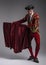 Studio shot of man dressed as Spanish matador