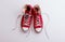 A studio shot of pair of canvas shoes on white background. Flat lay.