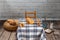 Studio shot of a scene from a room in a rural house. with a table with a retro checkered tablecloth, with flour, bread, muffins