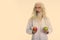 Studio shot of senior bearded man doctor thinking while holding red apple and green apple