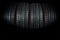 Studio shot of a set of summer car tires on black background. Tire stack background. Selective focus. Car tyre protector close up.