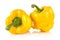 Studio shot of slices of yellow bell peppers on white