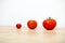 Studio Shot of three cherry tomatoes in a row