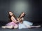 Studio shot of two graceful ballet dancers