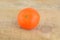 Studio shot wet tangerine isolated on wooden table