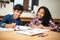 Study buddies make homework easier. two young students studying together in a classroom.