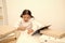 Studying hard. Girl child reads book while sit table white background. Schoolgirl studying and reading book. Kid school