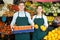 Stuff in apron selling sweet oranges, lemons and tangerines