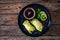 Stuffed Asian cabbage rolls and soy sauce on wooden background