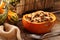 Stuffed autumn pumpkin with rice and mushrooms, seasonal dinner