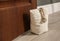 Stuffed bag holding wooden door