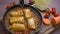 Stuffed cabbage in a pan fried in tomato sauce