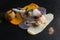Stuffed chicken breast, white meat chicken, different sauces on dark background. Molecular cuisine