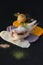 Stuffed chicken breast, white meat chicken, different sauces on dark background. Molecular cuisine