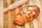 Stuffed croissant on the wooden board