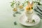 Stuffed or deviled eggs with yolk, shrimp, pea microgreens with paprika in rabbit-shaped stand for easter table decorate fresh
