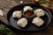 Stuffed dumplings, manti of dough and minced. Still life on a wooden board. Close up