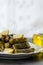 Stuffed grape leaves with rice,olive oil and herbs in white plate