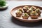 stuffed mushrooms on a ceramic dish