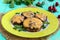 Stuffed mushrooms with salami and mozzarella cheese in a clay bowl