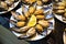 Stuffed mussels in a white dish, midye dolma. Turkish cuisine. Snack.