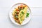 Stuffed omelette with tomatoes, red bell pepper and broccoli