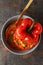 Stuffed pepper in bowl on dark textured background