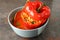 Stuffed pepper in bowl on dark textured background