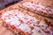 Stuffed pizza Neapolitan recipe with mozzarella, oregano, tomato and seasoning to taste