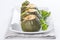 Stuffed round courgettes with grated cheese