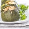 Stuffed round courgettes with grated cheese