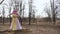 A stuffed shrovetide in a light dress and a pink kerchief is placed in the park during the holiday. A effigy of