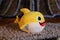 Stuffed yellow shark with funny look