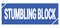 STUMBLING BLOCK text written on blue stamp sign