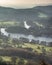 Stuning vibrant Autumn Fall landscape image of view from Gummers How down onto Derwent Wter in Lake District