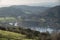 Stuning vibrant Autumn Fall landscape image of view from Gummers How down onto Derwent Wter in Lake District