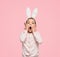 Stunned little girl in Easter bunny ears