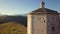 Stunning 4k riseup aerial of countryside church in the valleys of Abruzzo, Italy