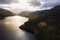 Stunning aerial drone landscape image of glorious vibrant Autumn Fall sun over Thirlmere in Lake District