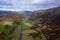 Stunning aerial drone landscape image of glorious vibrant Autumn Fall sun over Thirlmere in Lake District