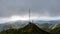 Stunning aerial drone view of a communications tower at the summit end of famous Wiliwilinui Ridge Hiking Trail near Honolulu on t