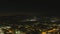 Stunning aerial footage of fireworks on the fourth of July at night with a landscape filled with city lights and mountain ranges