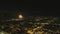 Stunning aerial footage of fireworks on the fourth of July at night with a landscape filled with city lights and mountain ranges