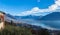 Stunning aerial panorama view of  Locarno cityscape and Lake Maggiore from Madonna del Sasso church, snow covered Swiss Alps