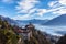 Stunning aerial panorama view of Madonna del Sasso church above Locarno city with Lake Maggiore, snow covered Swiss Alps mountain