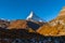 Stunning aerial panorama view of Zermatt town with the famous Matterhorn peak of Swiss Alps in background and golden forest on