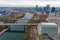 A stunning aerial shot of the silky green waters of the Cumberland river with bridges over the water and streets filled with cars