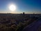 A stunning aerial shot of vast miles of lush green trees, the freeway, the Chattahoochee river and blue sky at sunset