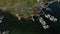 Stunning aerial view of boat pier and rocky water shore with colorful norwegian rorbu houses