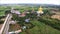 Stunning Aerial View of a Massive Golden Seated Buddha Image at Wat Muang Temple in Ang Thong Province, Thailand